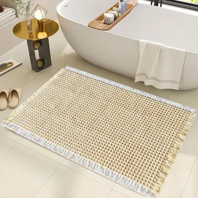 Productafbeelding van Badmat met wafelmotiervaring, super absorberend, antislip, machinewasbaar, 46 x 77 cm, lichtgeel/wit