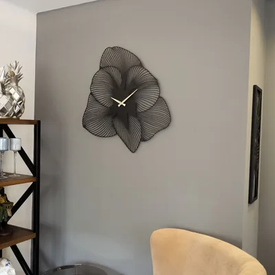 A modern living room with a decorative wall clock.