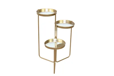A three-tiered gold plant stand with round glass shelves, photographed against a white background.