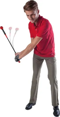 A man in athletic wear is demonstrating a golf swing training aid.