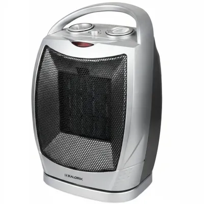 A silver and black electric heater with a black mesh front and a silver handle on top.