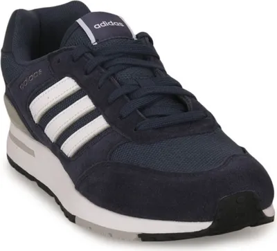A single navy blue Adidas sneaker with white stripes is shown from a three-quarter angle against a white background.