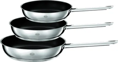 Three stacked frying pans on a white background.