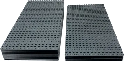 Two stacks of dark gray building baseplates are shown.