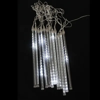 A string of white LED icicle lights against a black background.
