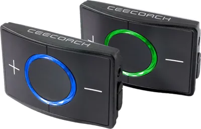 Two black electronic devices with illuminated rings, one blue and one green, are shown diagonally against a white background.