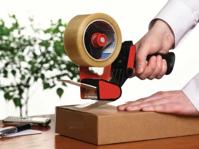 Produktbild von Tesa Abroller mit Packband (2 Rollen) - Pistolengriff