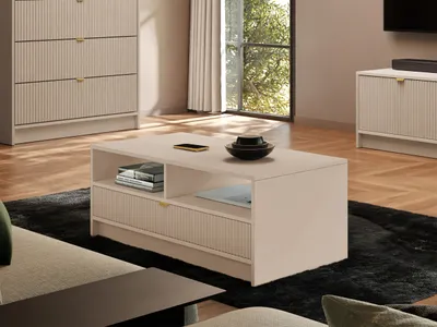 A modern living room scene featuring a coffee table, a chest of drawers, and a media console.