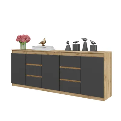 A modern sideboard with dark gray doors and drawers contrasted with a light wood-effect frame, decorated with small bird figurines and a bouquet of flowers.