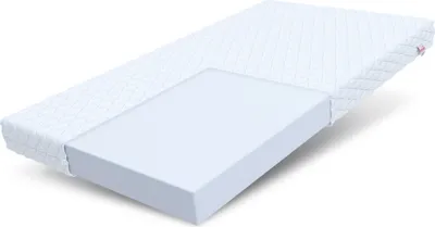 A mattress is shown with a cutaway revealing its foam layers.