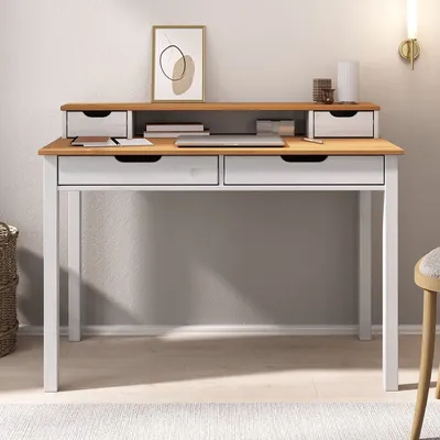 A desk with drawers and an organizer shelf, set against a light gray wall.