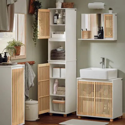 A bathroom scene with various storage units and a sink.