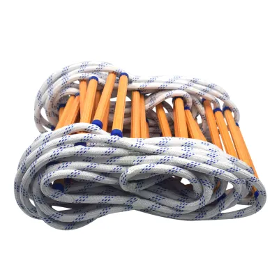 A coiled rope ladder with wooden rungs and blue accents, isolated on a white background.