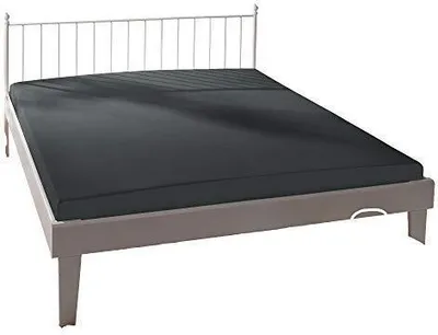 A bed with a dark gray fitted sheet.
