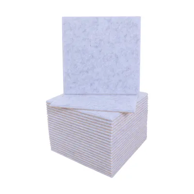 A stack of light gray acoustic panels with one panel standing upright on top.