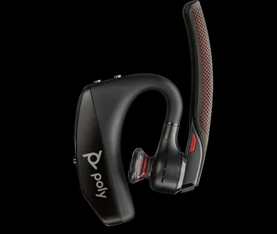 A black wireless headset with red accents is shown against a black background.
