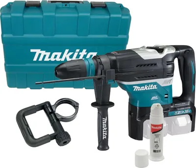 A collection of power tools and accessories, including a hammer drill, case, and lubricant, laid out on a white background.