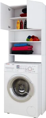A white washing machine cabinet with shelves filled with towels and bottles, and a washing machine below.