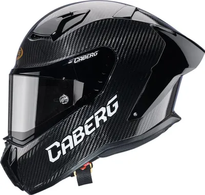 A black carbon fiber motorcycle helmet with a tinted visor.