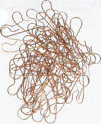 A pile of copper-colored Christmas ball hangers on a white background.