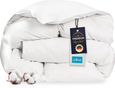 A folded white duvet with a product tag attached.