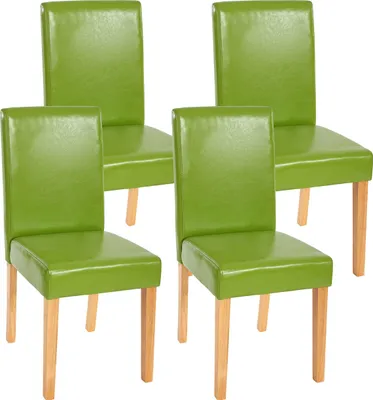Four green dining chairs with light wooden legs are arranged in a studio setting against a white background.