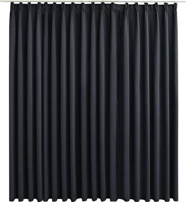 A dark gray curtain hanging from a rod.