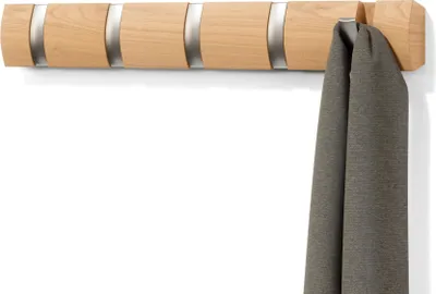 A wooden coat rack with five hooks is mounted on a white wall, with a gray scarf hanging from one of the hooks.