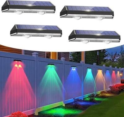 Four solar wall lights are shown at the top, and a row of these lights are installed on a fence at the bottom, illuminating the fence and ground with colorful lights.