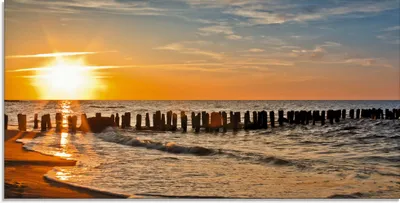 Produktbild von ARTland Glasbild Schöner Sonnenuntergang am Strand Größe: 100x50 cm