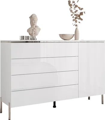 A white chest of drawers with a silver trim and legs, decorated with a bust and a vase with dried flowers.