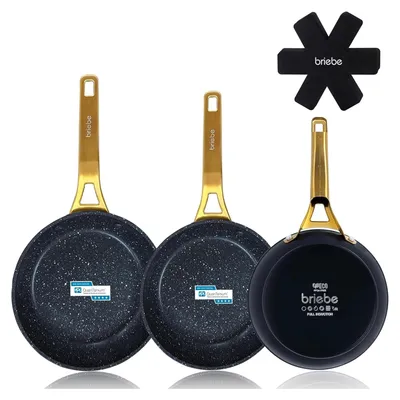 Three frying pans and a separator pad are displayed against a white background.