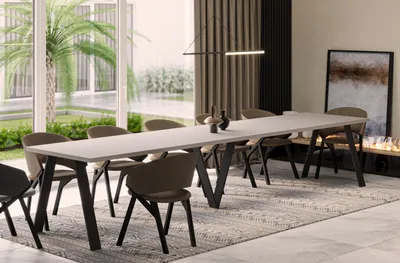 A modern dining room with a long table and chairs, set against a backdrop of large windows and curtains.