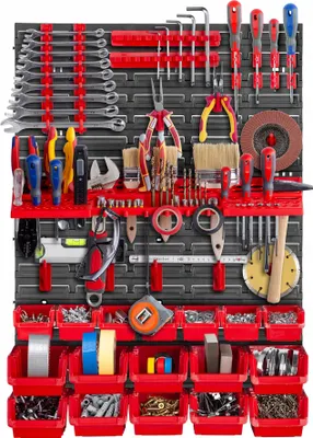 A well-organized tool wall with various tools neatly arranged on a pegboard system.