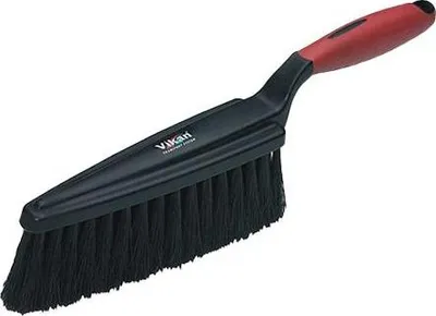 A cleaning brush with a black head and a red handle, isolated on a white background.