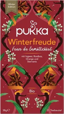 The image shows the front packaging of a Pukka Winterfreude herbal tea box, featuring decorative elements and product information.