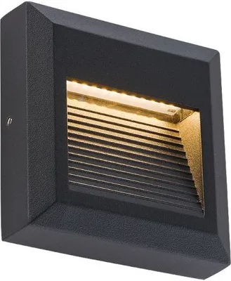 A black square LED wall light with a textured finish, mounted on a white background.