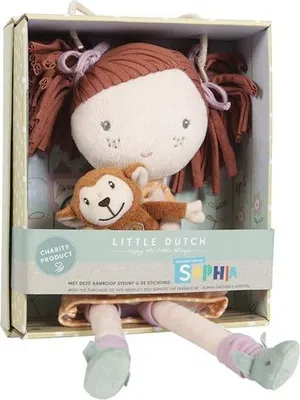 A doll and its monkey companion are displayed inside a retail box.