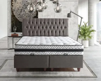 Produktbild von Die weiche Kontur des Bett mit Matratze schafft eine sanfte Atmosphäre.