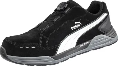 A black Puma safety shoe with white accents and a grey sole is shown against a white background.