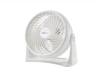 A white desk fan on a white background.