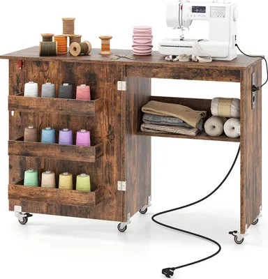 A sewing table with a sewing machine and various sewing supplies.