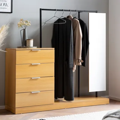 A modern wardrobe with a chest of drawers, a hanging rack with clothes, and a full-length mirror.