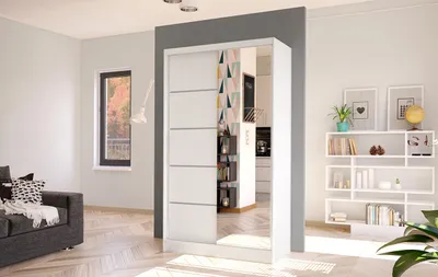 A modern living room with a sofa, a window, and a wardrobe with a mirrored door.