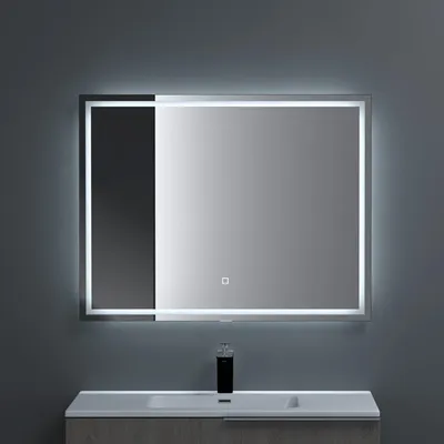 A modern bathroom vanity with a sink and a lit mirror above it.
