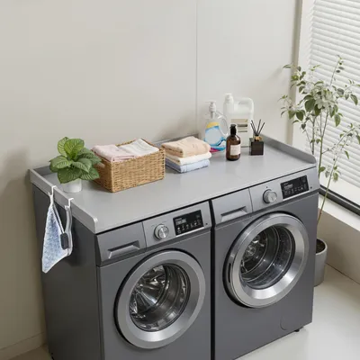 Zdjęcie produktu dla Blat SucceBuy do pralki i suszarki (137 x 69,9 cm) z podwyższoną krawędzią i haczykami, idealny do organizacji i przechowywania w szafie na bieliznę, spiżarni lub jako blat kuchenny, wytrzymałość do 113 kg, kolor szary