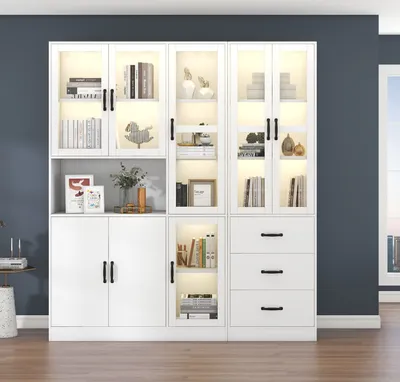 A modern white display cabinet with LED lighting, showcasing books and decorative items.