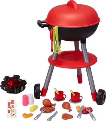 A toy barbecue grill set with various accessories laid out around it on a white background.