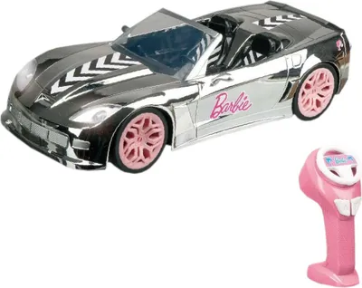 A silver Barbie convertible car with pink wheels and a pink remote control.