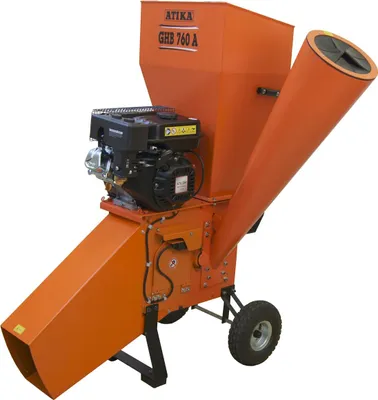 An orange garden shredder with a black engine, shown from a three-quarter angle against a white background.